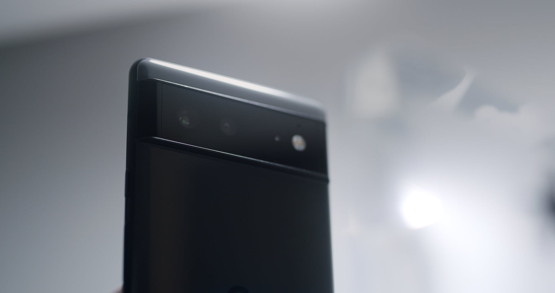 photo of a black phone with cameras